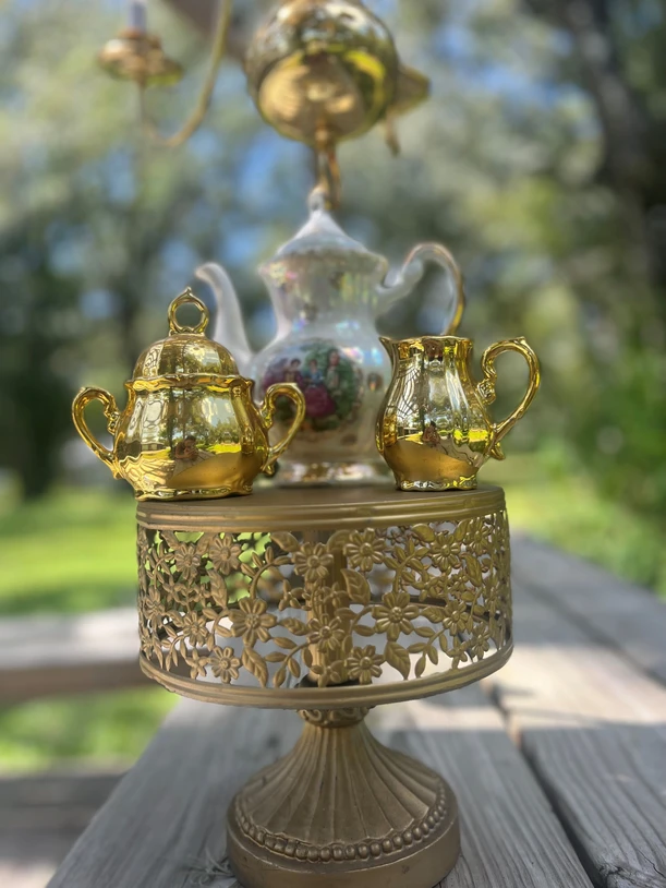 tea set on a gold cake stand