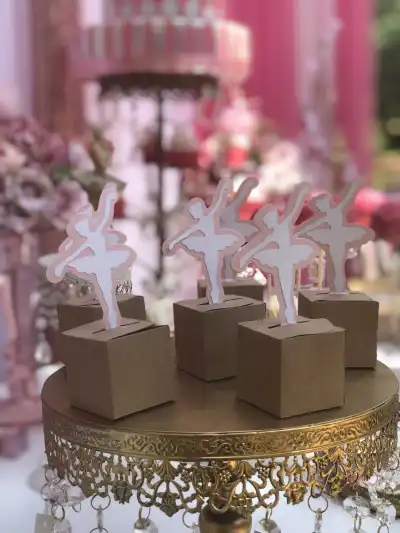 ballerina theme party | The Tea Party Company ballerina shaped favor boxes on top of a craft paper box
