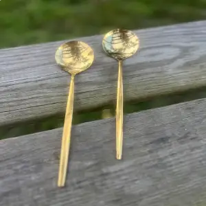 gold sleak design soup spoons