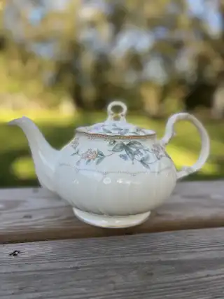 mismatch tea pots rentals | The Tea Party Company off white gold rim teapot flowers on lid