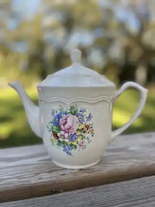 mismatch tea pots rentals | The Tea Party Company white teapot pink and blue flowers