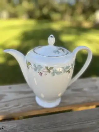 mismatch tea pots rentals | The Tea Party Company white tea pot gold rim and flower motif