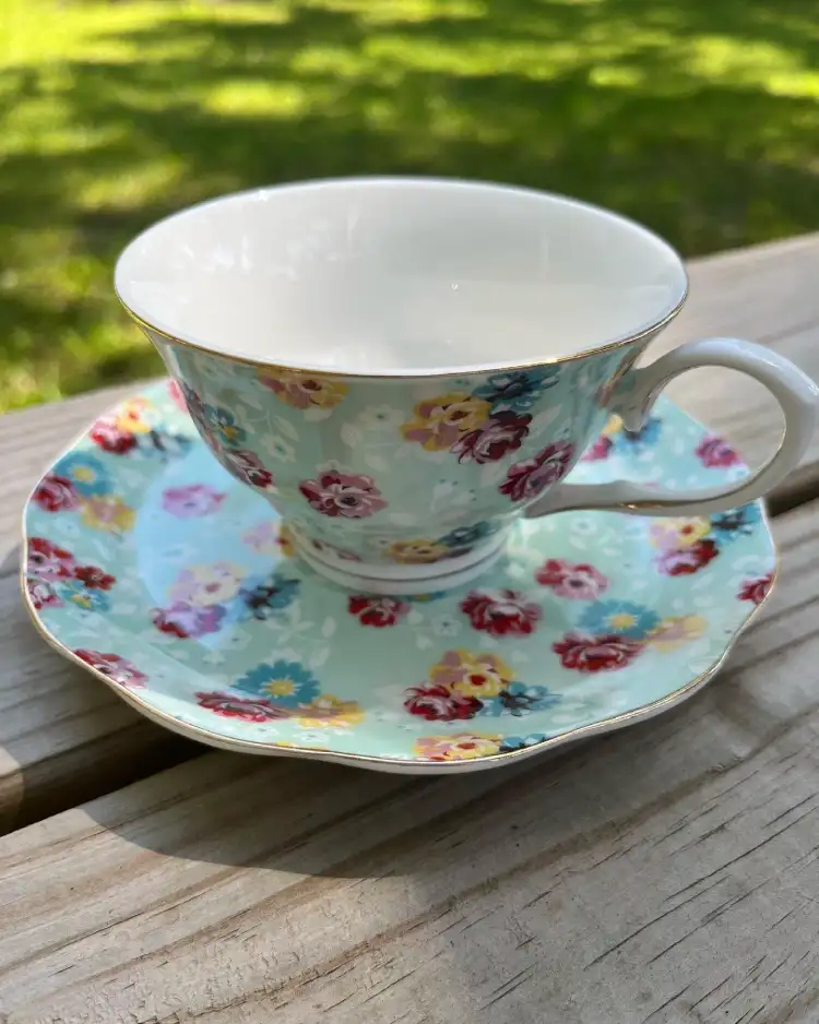 teacup and saucer pale blue and mini flowers