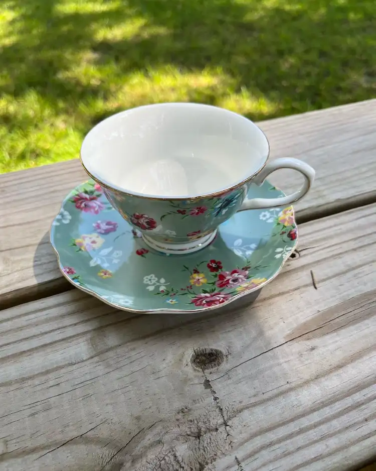 teacup and saucer aqcuamarine and flowers