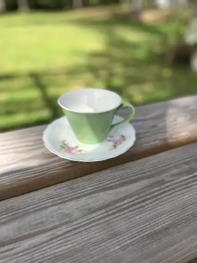 mismatch china rentals | The Tea Party Company green teacup white saucer flowers