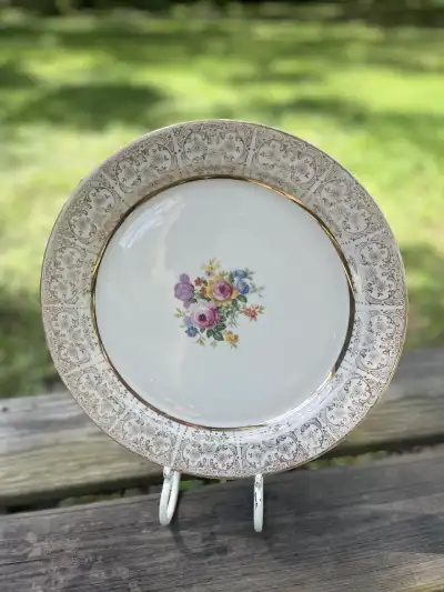 mismatch china rentals | The Tea Party Company Vintage style charger plate with 22 karate filigrana and flowers in the middle.