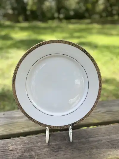 mismatch china rentals | The Tea Party Company White charger plate with a gol rim and another gold line near the center.
