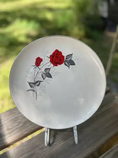 dinner plates rentals | The Tea Party Company vintage dinner plate with a red rose bush on the side