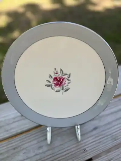 dinner plates rentals | The Tea Party Company Dinner plate with a grey rim and a small rose in the center