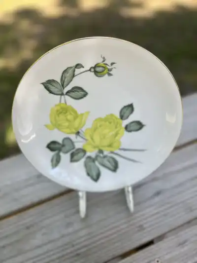 dinner plates rentals | The Tea Party Company Dinner plate with a yellow rose motif