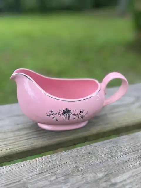 mismatch china rentals | The Tea Party Company Pink vintage gravy bowl with silver rim and some white and black branches motif in the center>