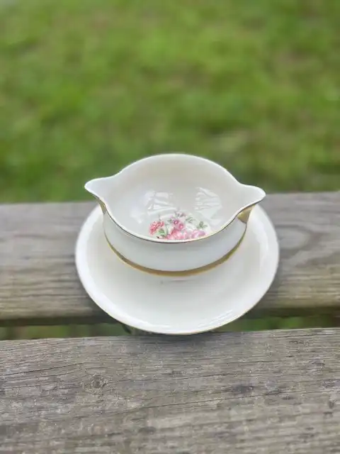 mismatch china rentals | The Tea Party Company white and gold with some flowers on the bottom gravy compote bowll.