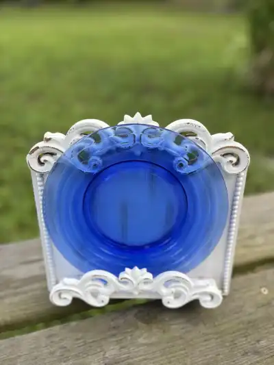 salad plates rentals | The Tea Party Company Cobalt Blue Glass Salad Plate Standing on a Wood Base.