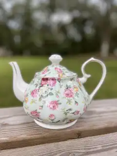 mismatch tea pots rentals | The Tea Party Company pastel green and pink flowers shabby chic style teapot