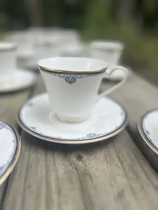 matching-tea-cups-and-saucers | The Tea Party Company white with a blue rim and gold accents teacups and saucers