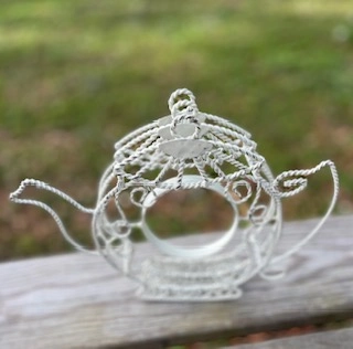 tea party rentals | The Tea Party Company white metal tea pot flowwer holder