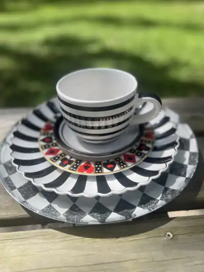 alice in wonderland theme party | The Tea Party Company black and white scalloped plate, diamond black and white charger black and white teacup