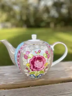 mismatch tea pots rentals | The Tea Party Company blue and pink teapot shabby chic style with a big rose in the middle