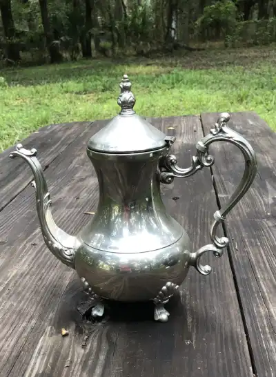 silver plated rentals | The Tea Party Company Shiny Silverr Tea Pot On Top of a Table.
