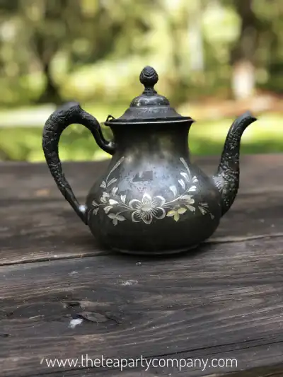 silver plated rentals | The Tea Party Company Tarnished Silverr Tea Pot On Top of a Table.