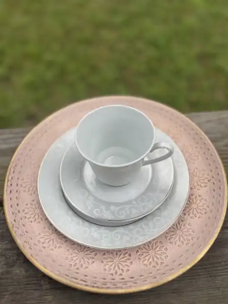 matching-tea-cups-and-saucers | The Tea Party Company white and silver teacup saucer and salad plate with a pink wood charger