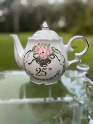 mismatch tea pots rentals | The Tea Party Company white teapot 25th anniversary