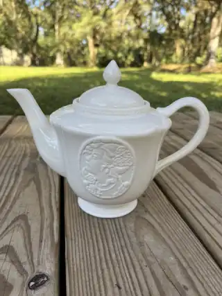 mismatch tea pots rentals | The Tea Party Company white teapot lady figure on side