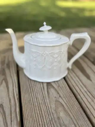 mismatch tea pots rentals | The Tea Party Company white teapot raised design