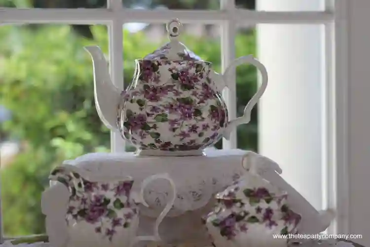 teapot,creamer and sugar bowl white with purple flowers